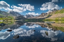 Crystal clear morning reflections at one of the high altitude lakes at Boz-Uchuk Kyrgyzstan x
