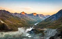 Daybreak in the Swiss Alps - view of the valley and glacial moraines from Cabane de Moiry Valais Switzerland 