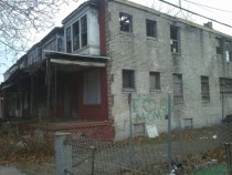 Depressing graffiti on derelict homes in Camden NJ 