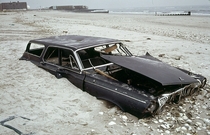Dodge Polara buried in the sand at Breezy Point Queens  by Andy Blair 
