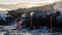 Earth Air Fire and Water Lava from Kilauea dripping into the sea the Big Island Hawaii 