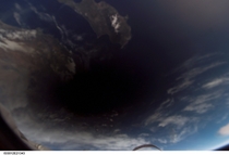 Eclipse - A shadow of the moon falls on Earth seen from the International Space Station in  