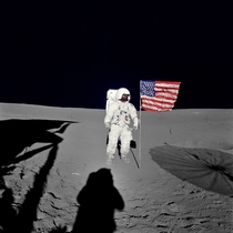 Edgar D Mitchell lunar module pilot for the Apollo  lunar landing mission stands by the US flag during the early moments of the first EVA of the mission He was photographed by Alan B Shepard Jr mission commander using a mm modified lunar surface Hasselbla