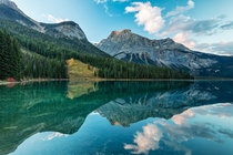 Emerald Lake Yoho National Park British Columbia Amid the conifer-clad slopes high peaks and fluffy clouds reflected in Emerald Lake is a meadow that seems out of place It is an avalanche slide path created in the winter of  Kirk Lougheed 