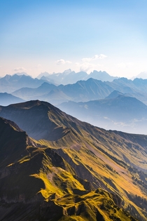Endless mountain layers glowing in the morning light Bern Switzerland  by hansiphoto