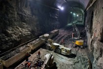 Far beneath the bustling streets of Manhattan and out of sight for the majority of New York Citys  million residents the largest transportation project in the country is churning away day and night hollowing out granite to create six miles of new tunnels 