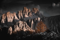 Fiery peaks one autumn sunset over the Dolomites looking out from Cinque Torri Dolomites Italy  OC IG arvindj