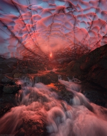 Fire and Ice A huge ice cave under Mutnovskiy volcano Kamchatka  Photo by Daniel Kordan
