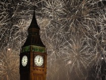 Fireworks explode across the London skyline and Big Ben 