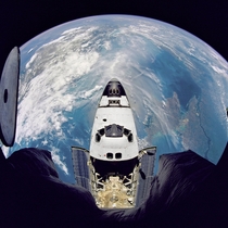 Fisheye view of the Space Shuttle Atlantis as seen from the Russian Mir space station during the STS- mission June  