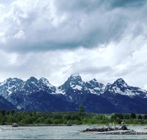 Floating the Snake River flowing beside the Grand Tetons Wyoming USA 