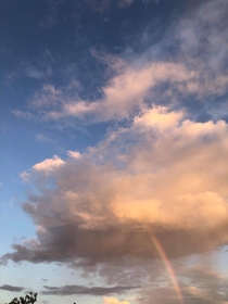 Florida Sky looks like the rainbow is coming directly out of the cloud