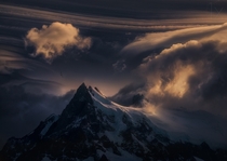 For Eternity Lenticular wave clouds over the peak of Cerro Grande Patagonia Argentina  Photo by Marc Adamus