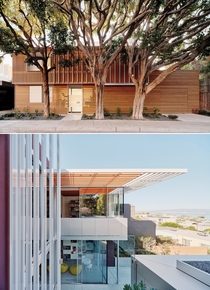 Front and rear faade of a residence with glass pavilion and aluminum trellises San Francisco California by Fougeron Architecture Photo Joe Fletcher 