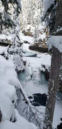 Frozen drop pools on Johnston Canyon Trail Canadian Rockies AB 