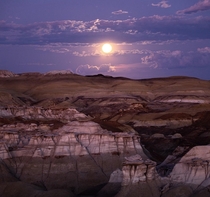 Full moon rising over the surreal Bisti badlands in New Mexico 