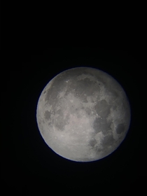 Full moon Taken with an iPhone  and a Celestron Powerseeker EQ