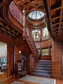 Grand staircase with intricate woodwork and wall panelling in a restored  Queen Anne Victorian mansion Plainfield Union County New Jersey