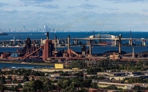 Hamilton steel plant with Burlington Skyway and Toronto skyline in the background 