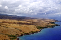 Hawaiis Big Island has one of the most diverse climates in the world  dense rainforest  desert and  volcanic rock and the top of the Mauna Kea volcano is often covered in snow Here is a picture of the Kohala desert with a rainstorm in the background 