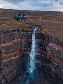 Hengifoss - waterfall with red layers in Iceland 