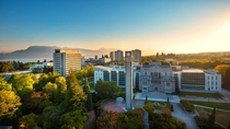 High-res photo of the University of British Columbia looking northeast past Main library and across Burrard Inlet at dawn 