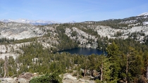 Hit the trail at the crack of noon and was treated to some of the most amazing views Ive ever seen This trail is now in my Top  Ive ever done Pictured here is one of the Ten Lakes in the Yosemite high country as seen from the descent from Ten Lakes Pass 