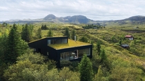 House in Iceland submerged in the forest designed by KRADS 