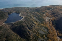 Hydroelectric reservoir perched on top of a hill in the Cape Breton Highlands Nova Scotia The power station itself is built underground and looks a lot like a Bond villains lair photo in comments 
