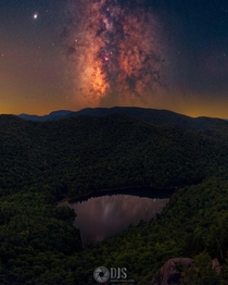 I cant believe I got this shotThe Milky Way reflecting in a little lake from the Adirondacks NY 