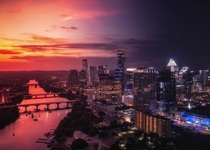 I took eleven photos of my citys skyline from sunset to night and merged them