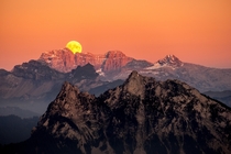 I went out to capture the sunset but then looked towards the other side and saw this incredible moonrise happening simultaneously Mount Gnipen Switzerland 