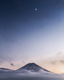 I went to see Mt Fuji twice during my trip to Japan only to find it completely covered in clouds This was taken during a short break in the upper clouds just around blue hour 