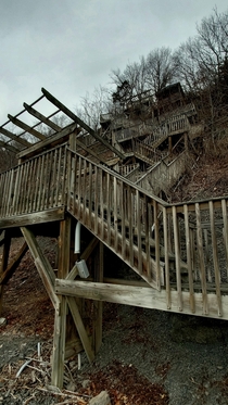If this staircase isnt abandoned its on its way Leads down to a train track by Cayuga Lake in NY