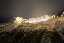 Illumination of a peak Aiguille de la Tsa in the Swiss Alps 
