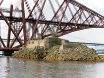 Inchgarvie island beneath the iconic Forth rail bridge Scotland Fort on the island dates back to early s