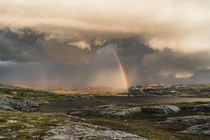 Incoming storm during a fishing trip in the high mountains Veivatnet Hardangervidda Norway 