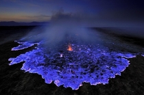 Indonesias Kawah Ijen Volcano Spews Blue Lava At Night Taken by Olivier Grunewald 