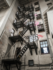 Inside an abandoned firefighter training facility complete with fire escape and hydrant