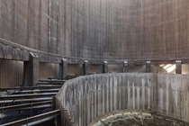 Inside an abandoned power plants cooling tower  by Sbastien Ernest