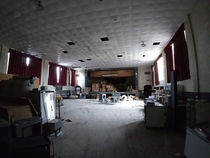 Inside the semi-abandoned gymauditorium of the  school building I attended K- Closed early s