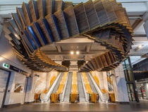 Interloop - Old wooden escalators repurposed into a sculpture at Wynyard Station Sydney