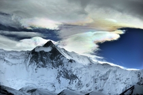 Iridescent ice clouds over the Himalayas by O Bartunova 