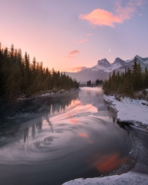 It was a chilly morning chunks of ice were flowing down the river and some of them got caught up in this vortex so I decided to make a long exposure to show the movement of the water Canmore Alberta 