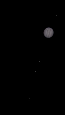 Jupiter with Europa Ganymede Io and Calistas shadow in transit