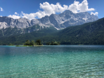Lake Eibsee with the tallest mountain in Germany Zugspitze in the background Garmisch-Partenkirchen Germany 