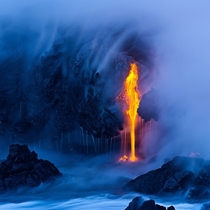 Lava flows into the ocean on the Big Island Hawaii  photo by Miles Morgan