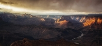 Light piercing the clouds to shine on the glorious Grand Canyon Arizona  photo by Danilo Faria