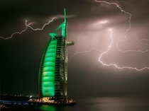 Lightning strikes above the sail-shaped Burj Al Arab hotel Dubai UAE Architect Tom Wright photo by Maxim Shatrov 