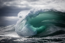 Liquid energy rising from the deep and morphing over a shallow reef before exploding and completing its journey back into the sea Warren Keelan 